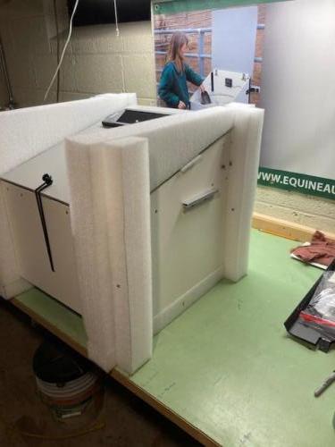 Custom packaging material to securely brace and cushion the unit during shipping 